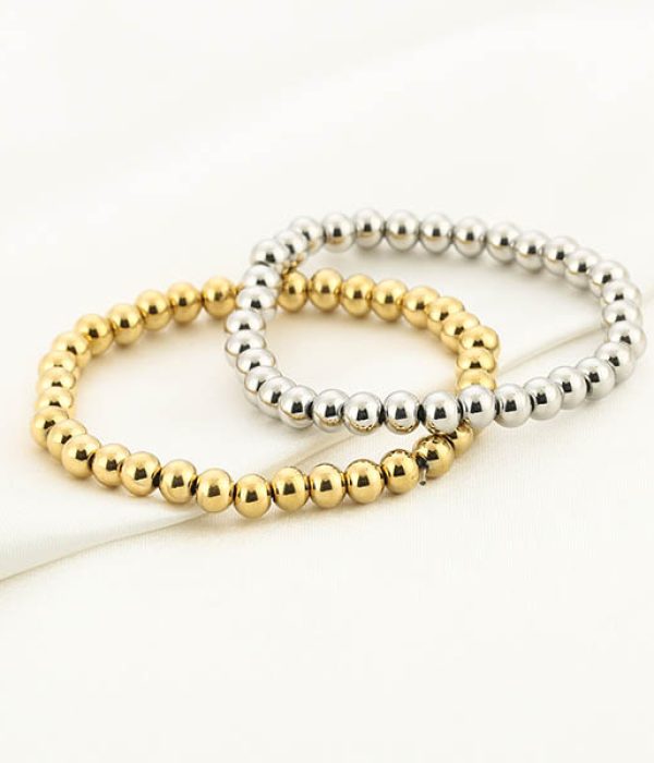 Michelle Bolletjes Armband RVS Evi goud en zilver op witte achtergrond